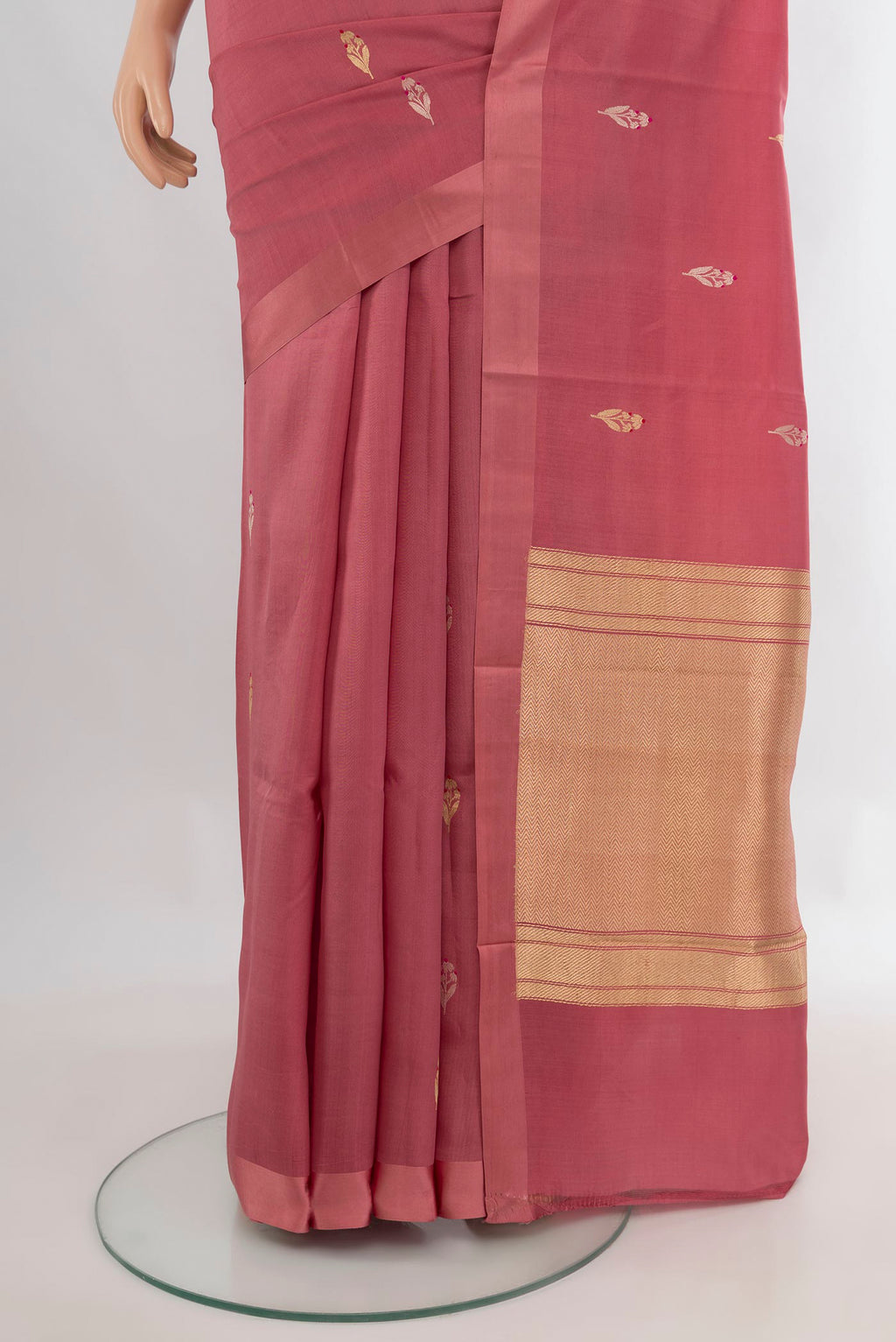 Pleats and pallu of Pure Silk Rose Gold Banarasi Katan Saree with Zari Butta on the body and Plain Border. 