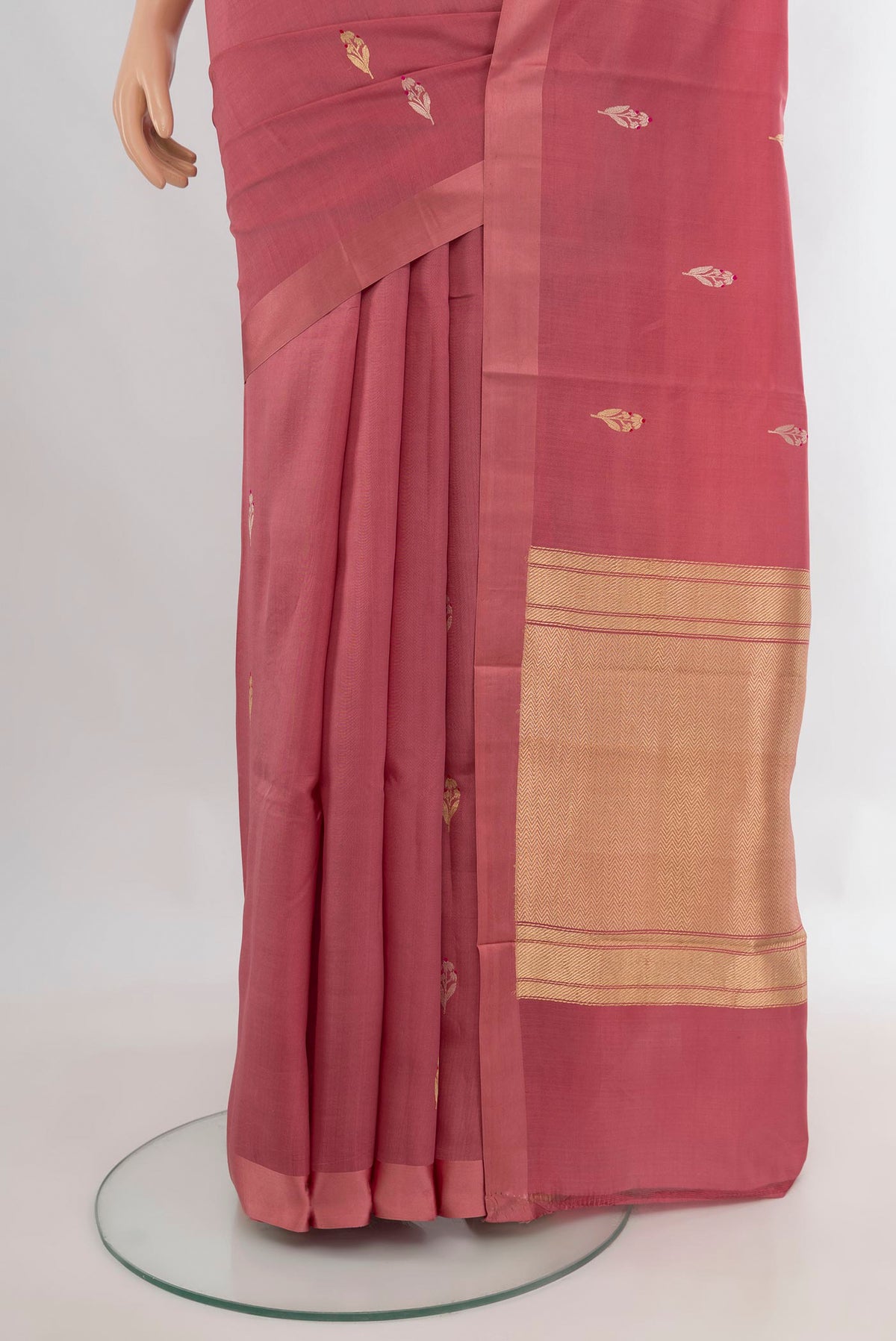 Pleats and pallu of Pure Silk Rose Gold Banarasi Katan Saree with Zari Butta on the body and Plain Border. 