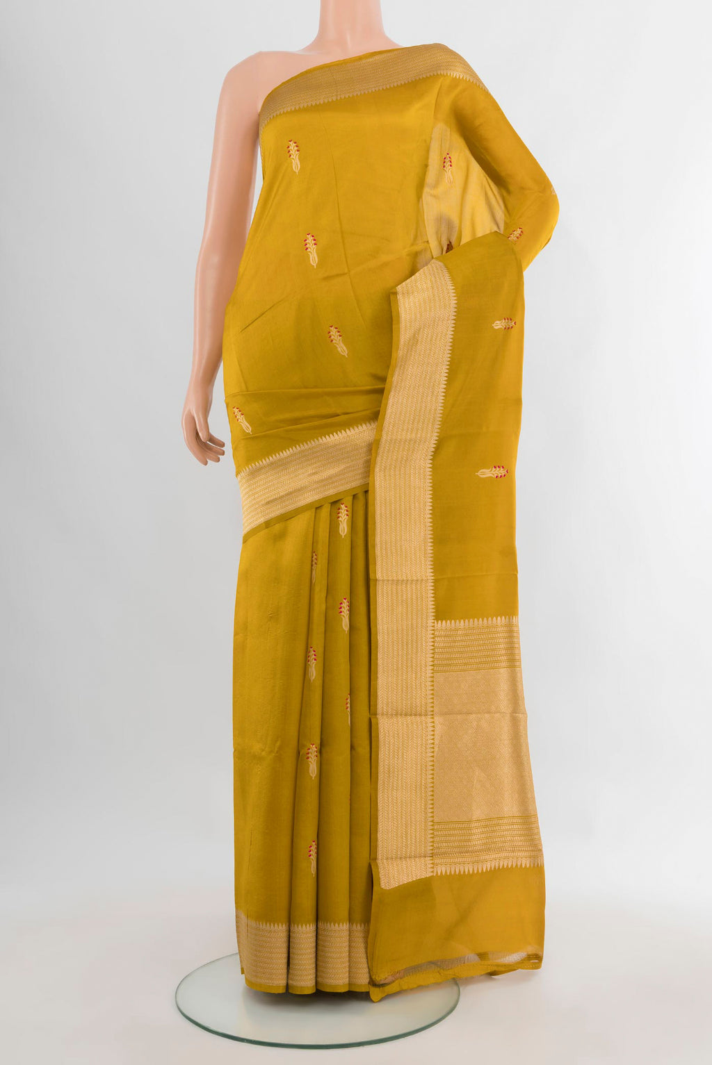 Pure Silk Mehandi Green Banarasi Katan Saree with Zari Butta on the body and Zari Border.  displayed on a mannequin