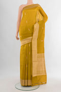 Pure Silk Mehandi Green Banarasi Katan Saree with Zari Butta on the body and Zari Border.  displayed on a mannequin
