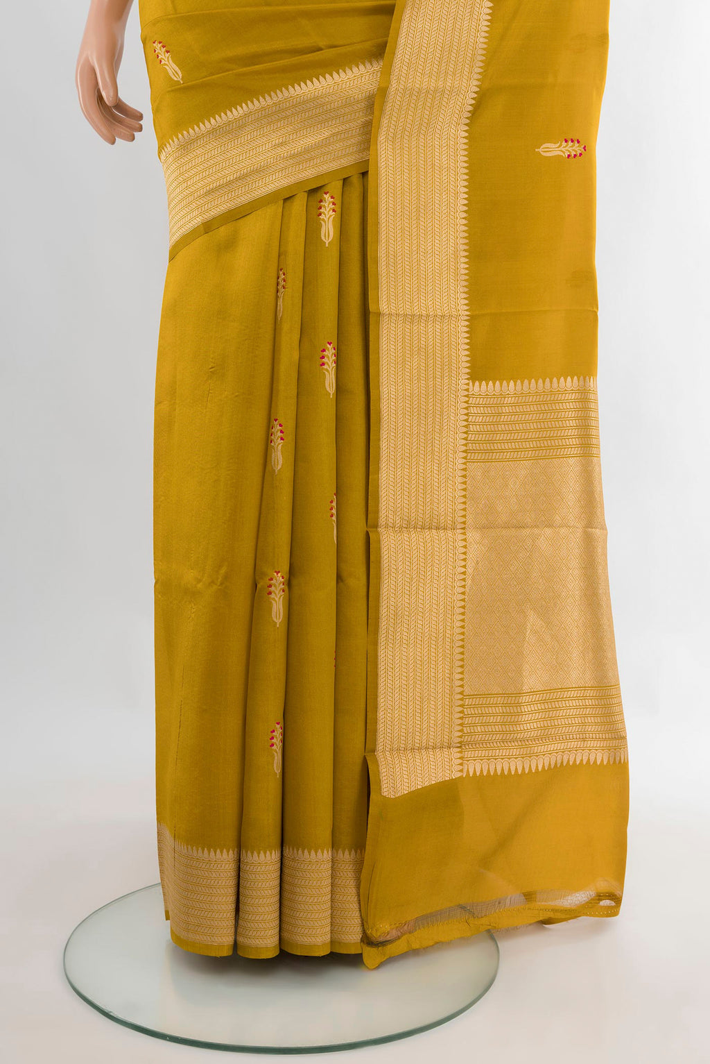 Pleats and pallu of Pure Silk Mehandi Green Banarasi Katan Saree with Zari Butta on the body and Zari Border. 