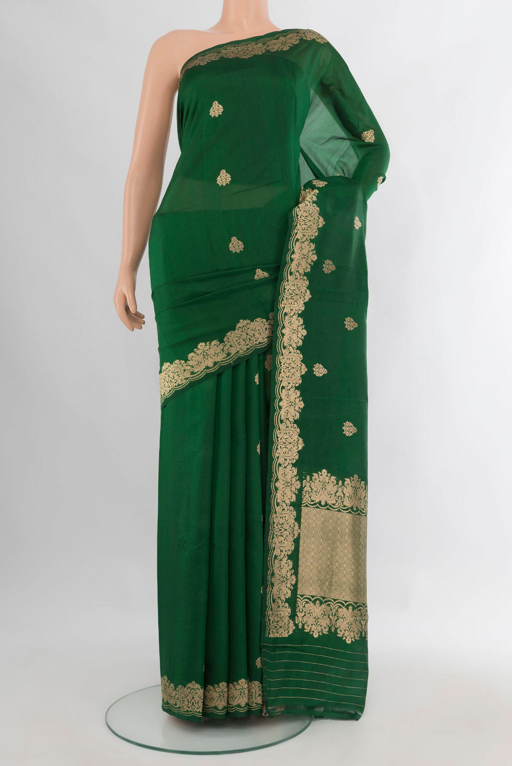 Pure Silk Bottle Green Banarasi Katan Saree with Zari Butta on the body and Fancy Border.  displayed on a mannequin