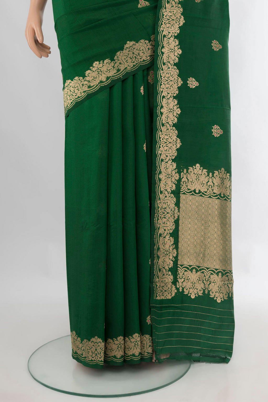 Pleats and pallu of Pure Silk Bottle Green Banarasi Katan Saree with Zari Butta on the body and Fancy Border. 