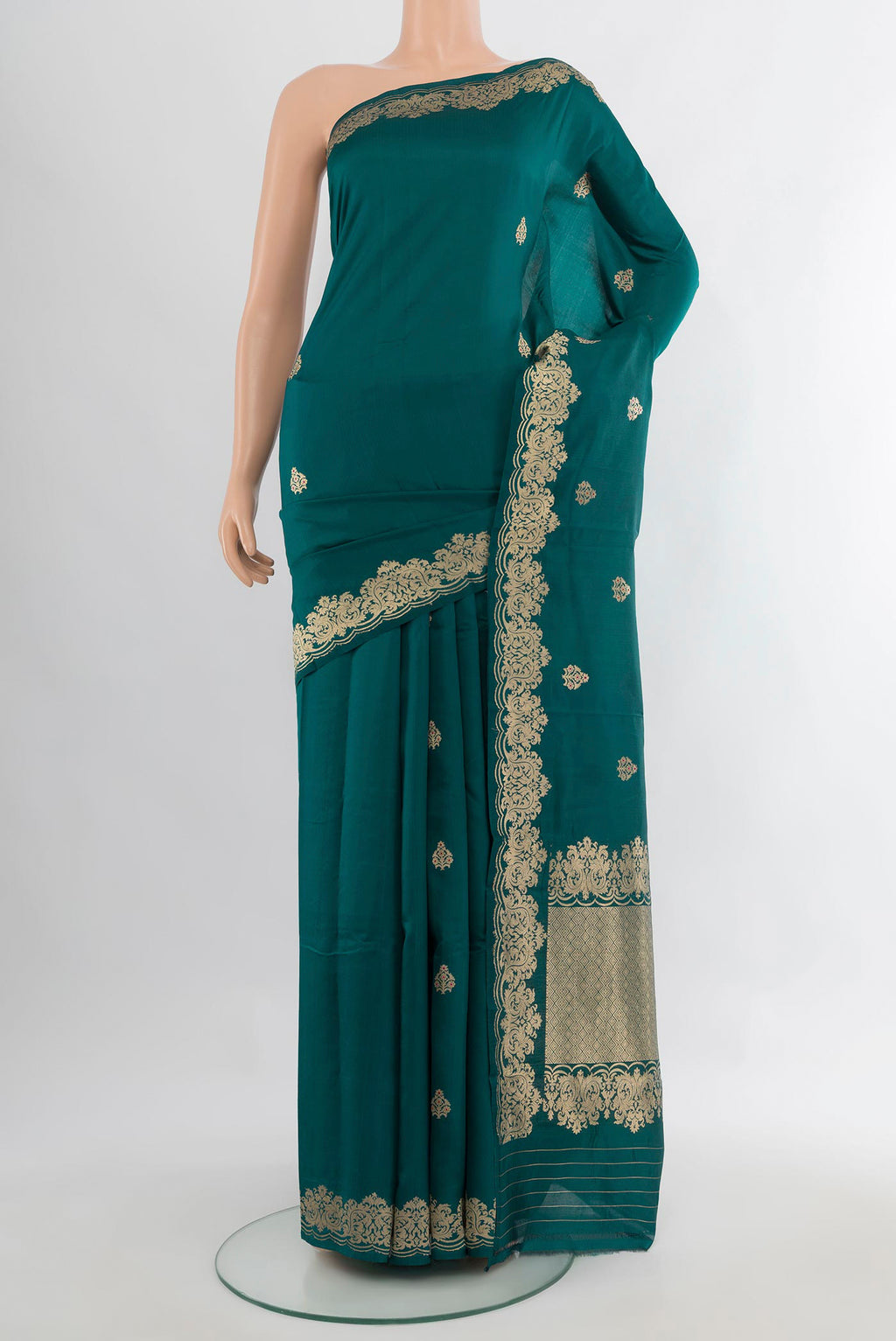 Pure Silk Blue Banarasi Katan Saree with Zari Butta on the body and Zari Border.  displayed on a mannequin