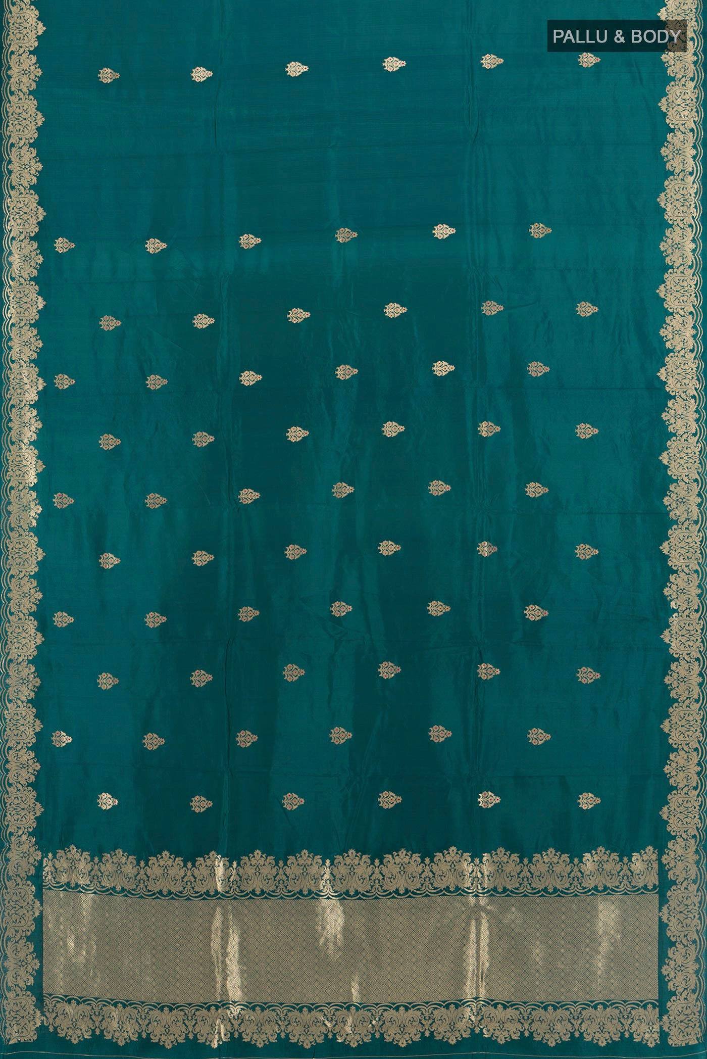 Flat view of Pure Silk Blue Banarasi Katan Saree with Zari Butta on the body and Zari Border. 