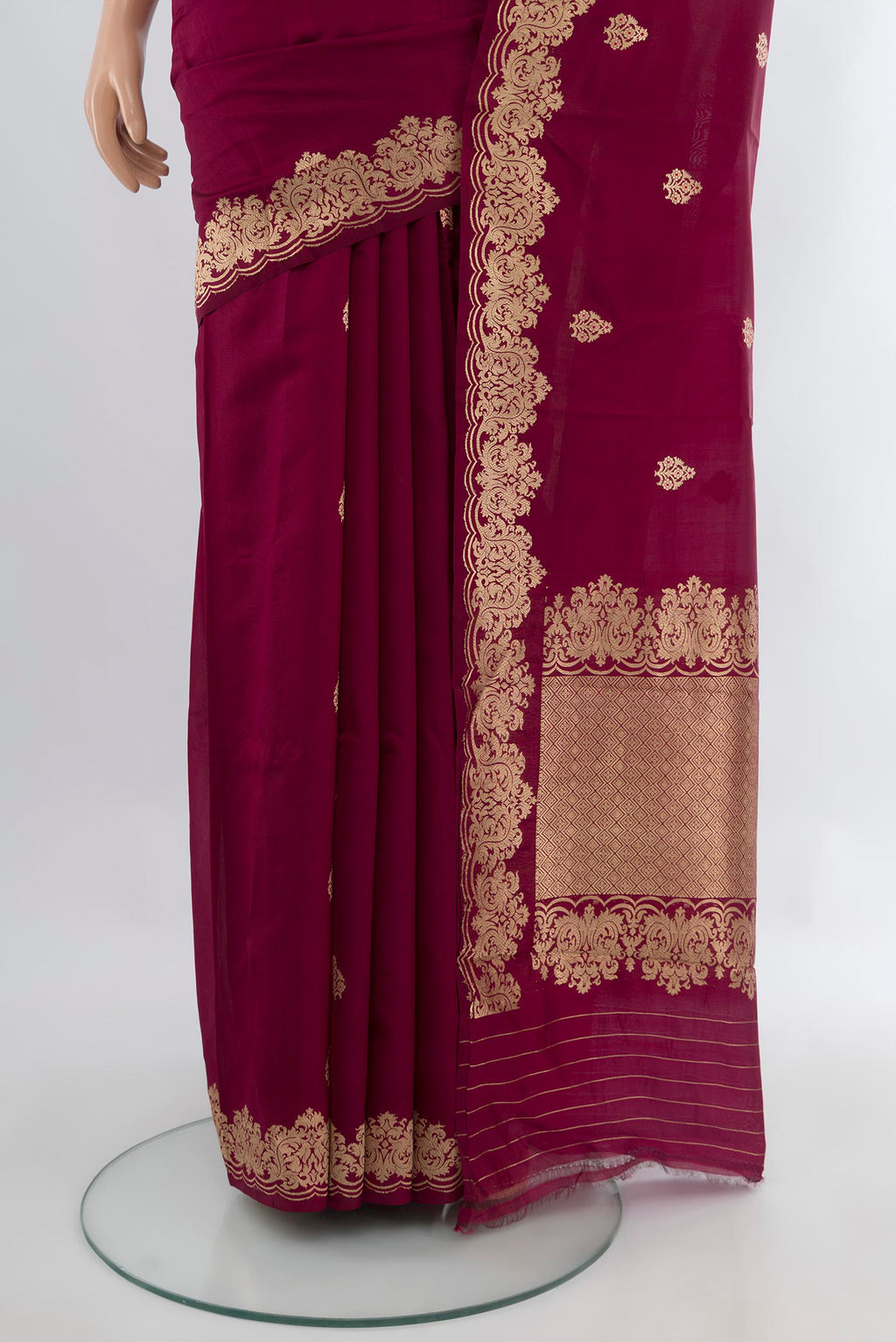 Pleats and pallu of Maroon Banarasi Katan Silk Saree with Zari Butta on the body and Fancy Border. 