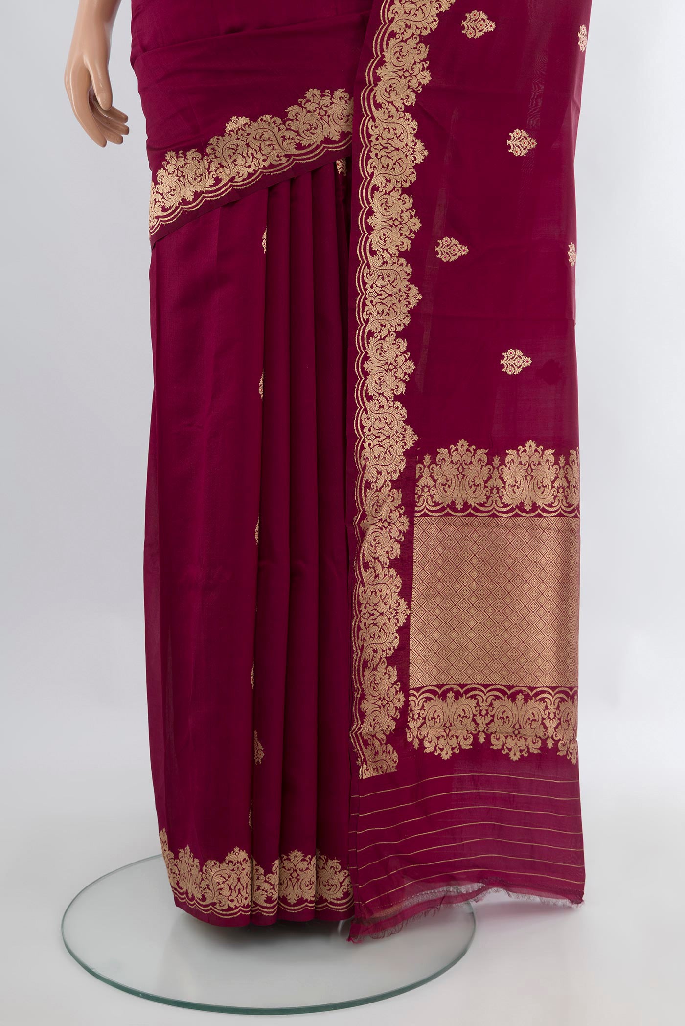 Pleats and pallu of Maroon Banarasi Katan Silk Saree with Zari Butta on the body and Fancy Border. 