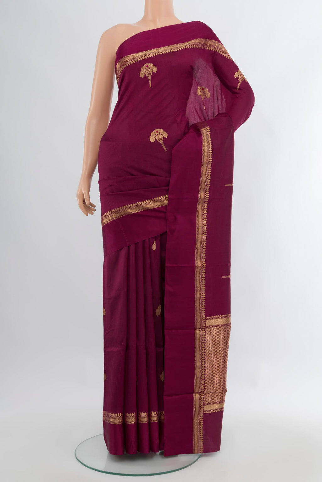 Magenta Banarasi Katan Silk Saree with Zari Butta on the body and Zari Border.  displayed on a mannequin