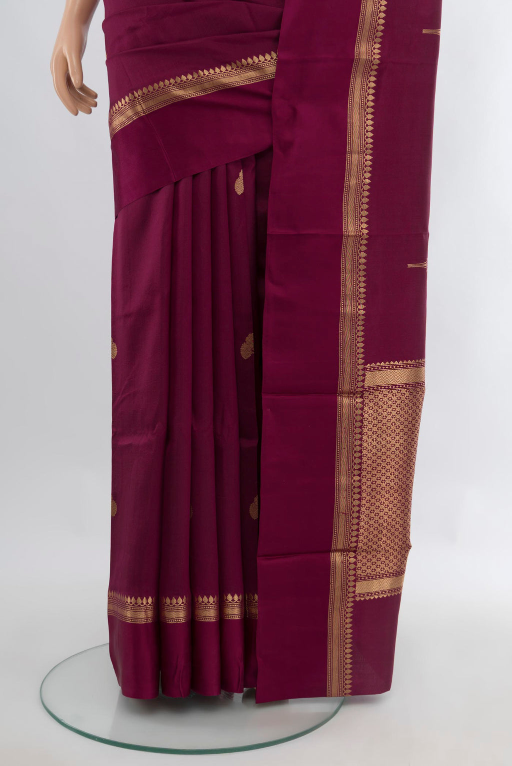 Pleats and pallu of Magenta Banarasi Katan Silk Saree with Zari Butta on the body and Zari Border. 