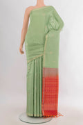 Pure Silk Pista Green Soft Saree with Zari Butta on the body and Zari Border.  displayed on a mannequin