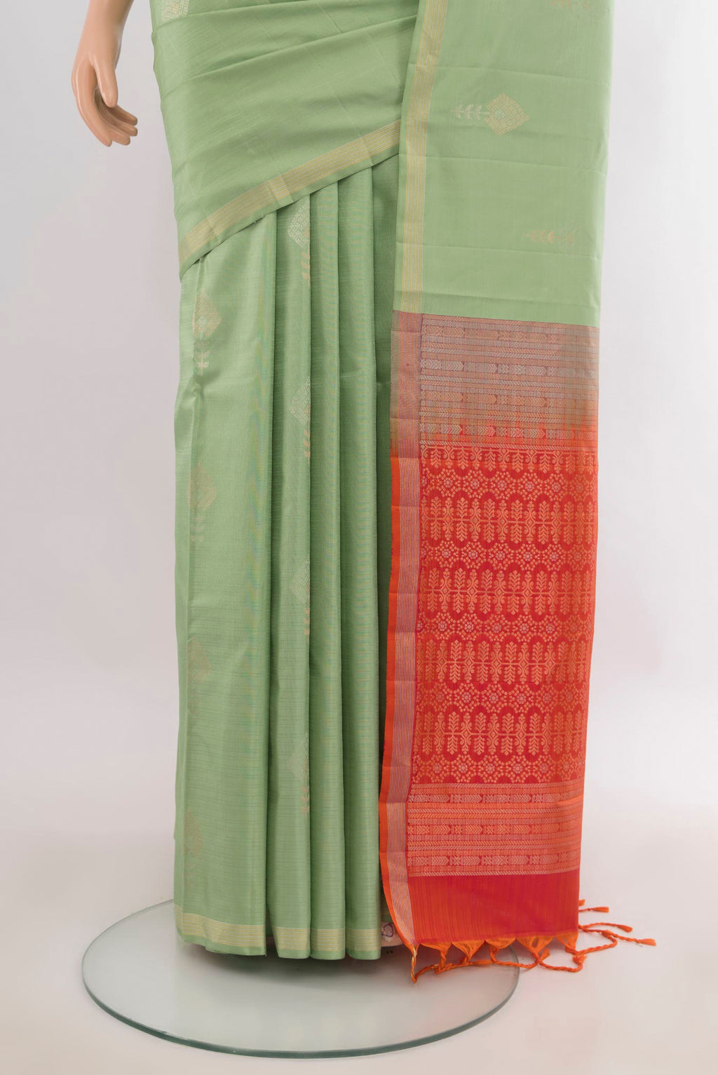 Pleats and pallu of Pure Silk Pista Green Soft Saree with Zari Butta on the body and Zari Border. 