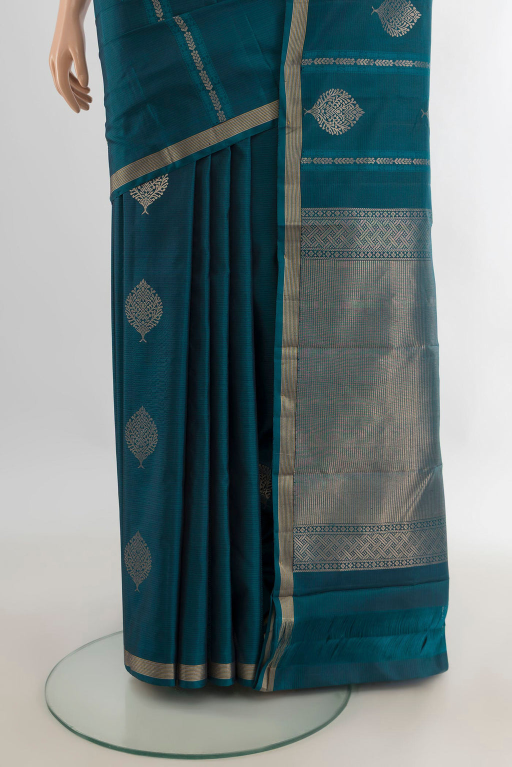 Pleats and pallu of Pure Silk Peacock Blue Soft Saree with Zari Butta on the body and Zari Border. 