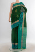 Pure Silk Green Soft Saree with Zari Butta on the body and Ikat Border.  displayed on a mannequin