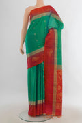 Pure Silk Light Green Soft Saree with Zari Butta on the body and Silk Border.  displayed on a mannequin