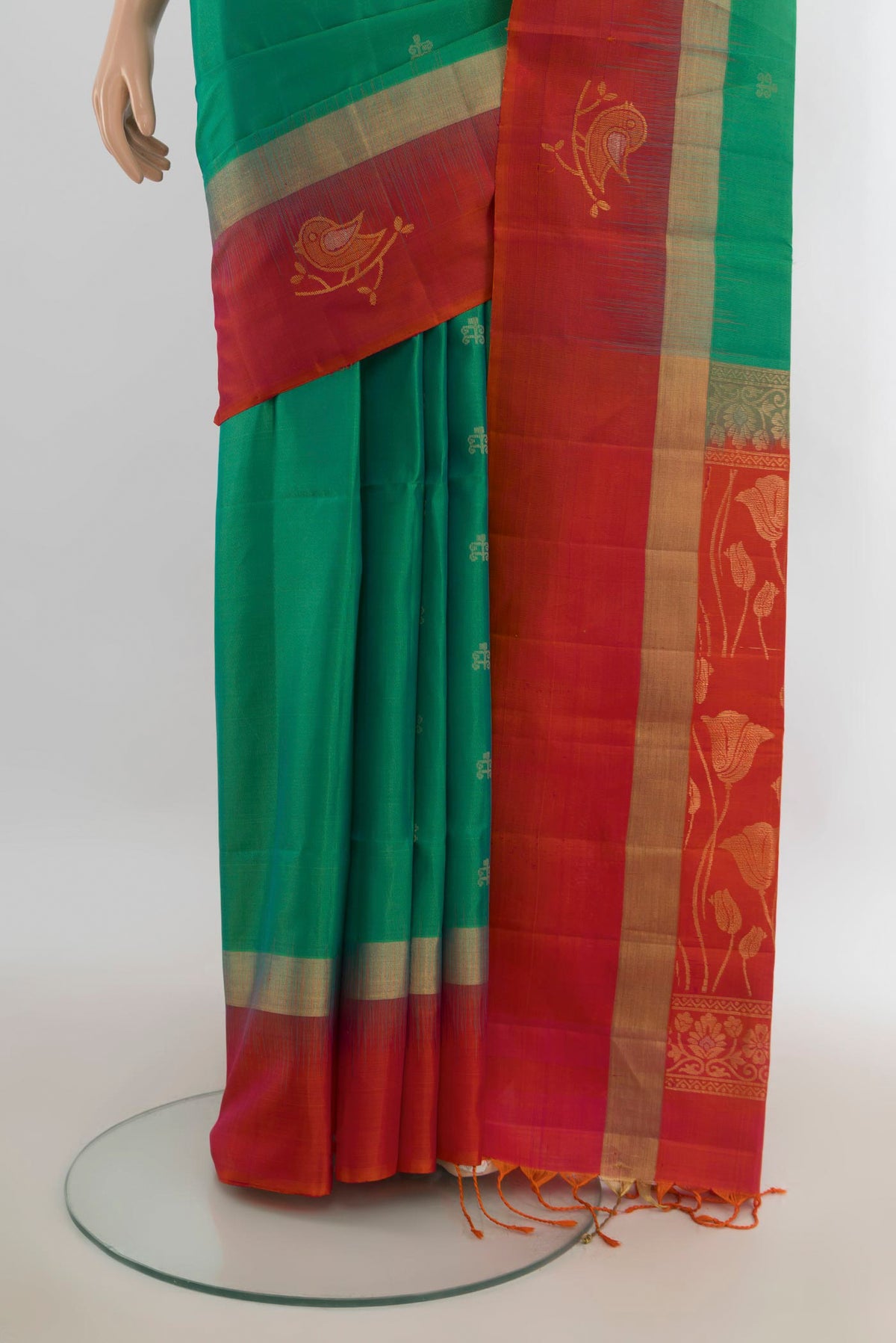 Pleats and pallu of Pure Silk Light Green Soft Saree with Zari Butta on the body and Silk Border. 