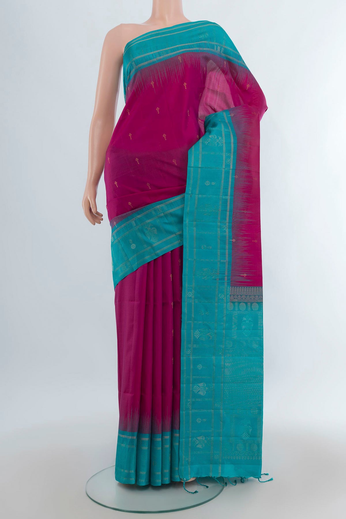 Pure Silk Magenta Soft Saree with Zari Butta on the body and Plain Border.  displayed on a mannequin