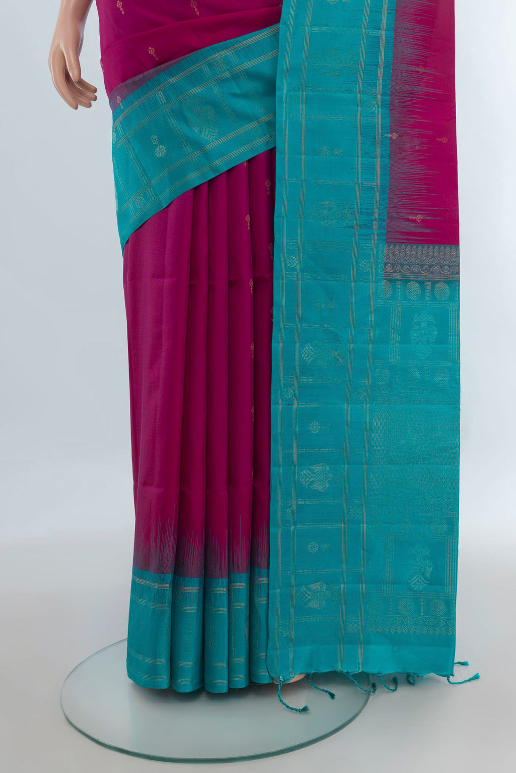 Pleats and pallu of Pure Silk Magenta Soft Saree with Zari Butta on the body and Plain Border. 