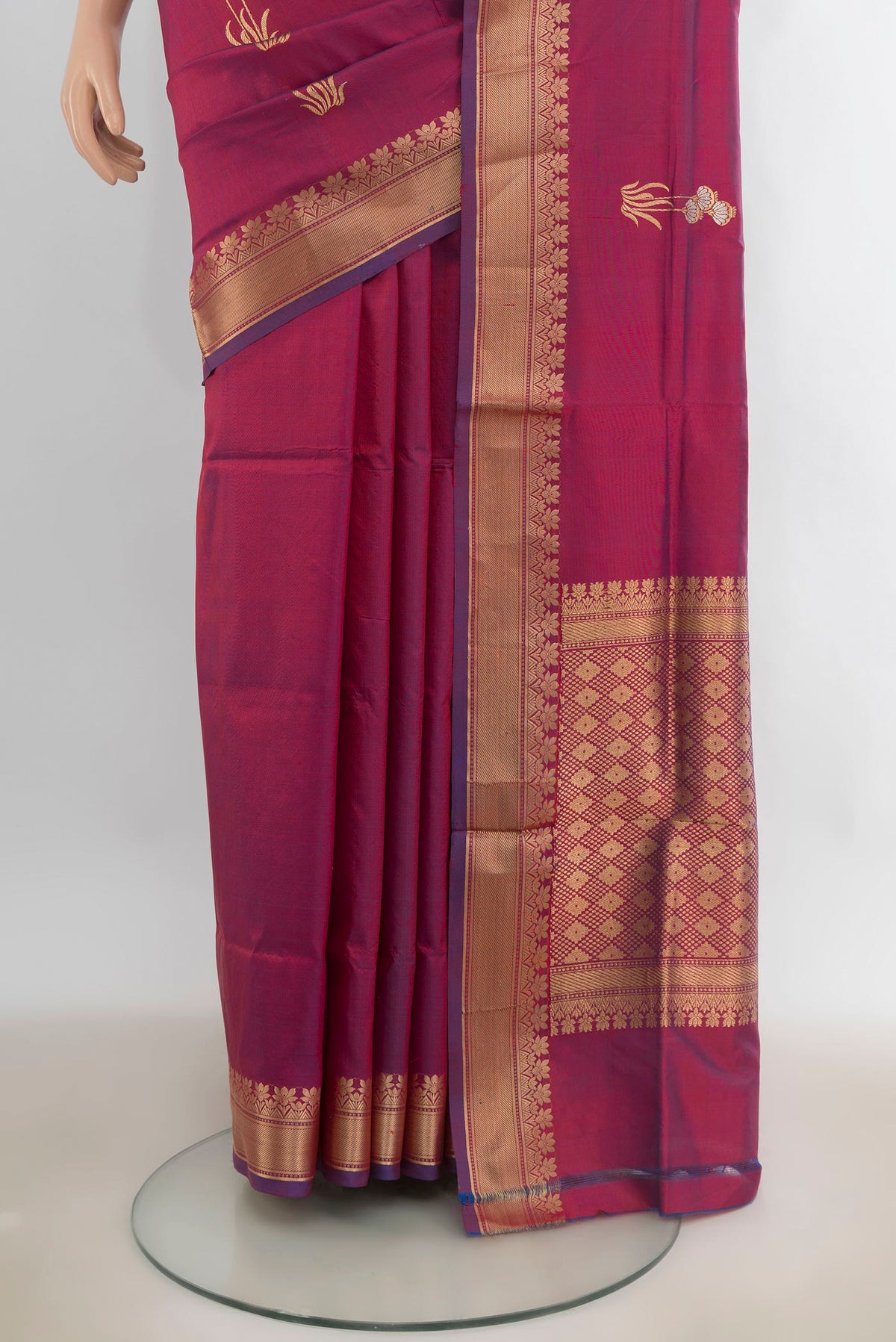 Pleats and pallu of Pure Silk Magenta Banarasi Katan Saree with Zari Butta on the body and Zari Border. 