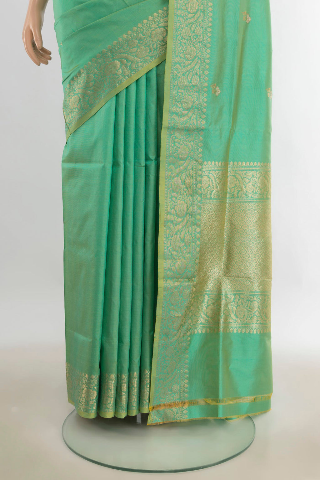 Pleats and pallu of Pure Silk Pista Green Banarasi Katan Saree with Zari Butta on the body and Silk Border. 