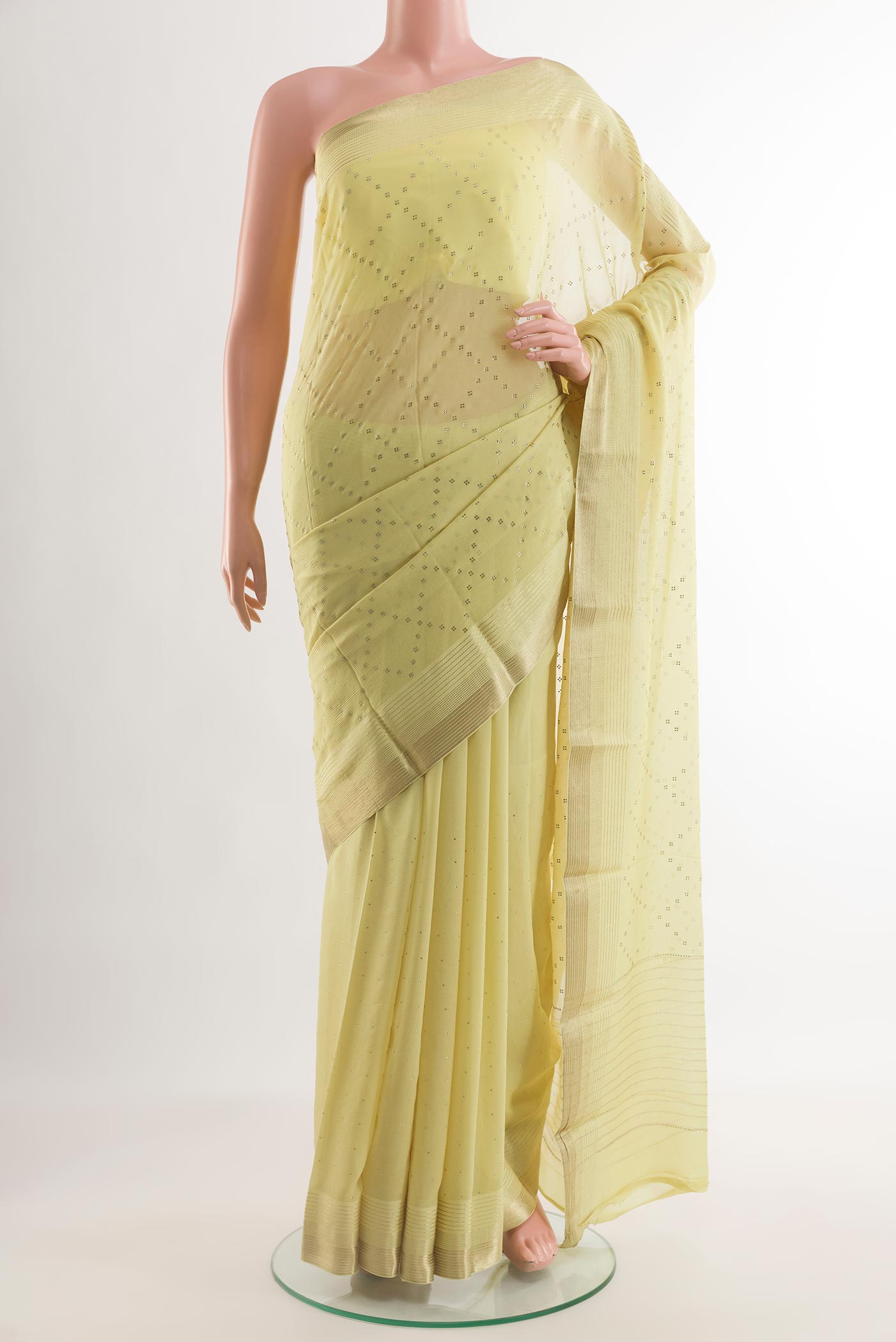 Lemon Yellow Mysore Chiffon Saree with Embroidery on the body and Zari Border.  displayed on a mannequin