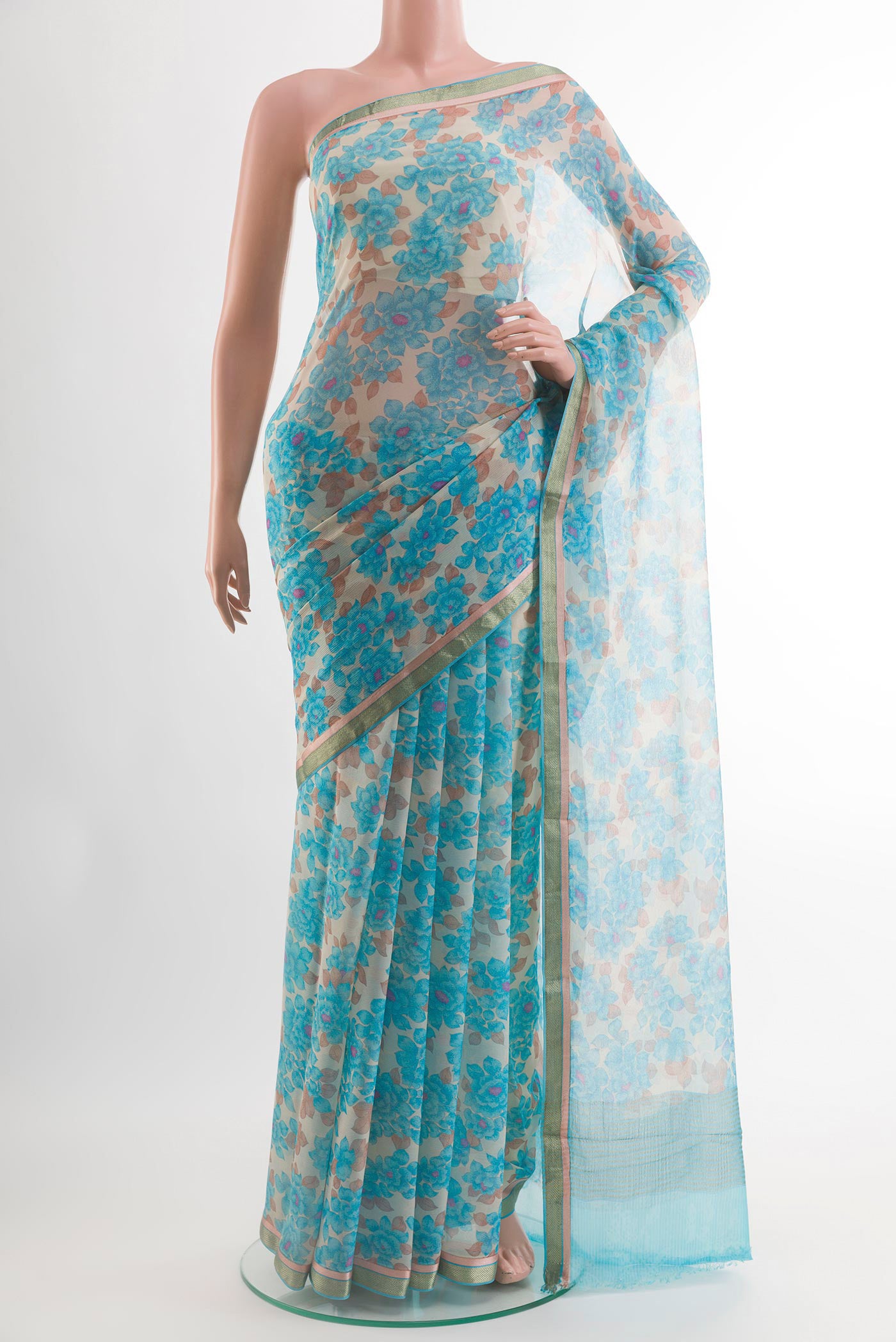 Blue Chiffon Saree with Printed design on the body and Zari Border.  displayed on a mannequin