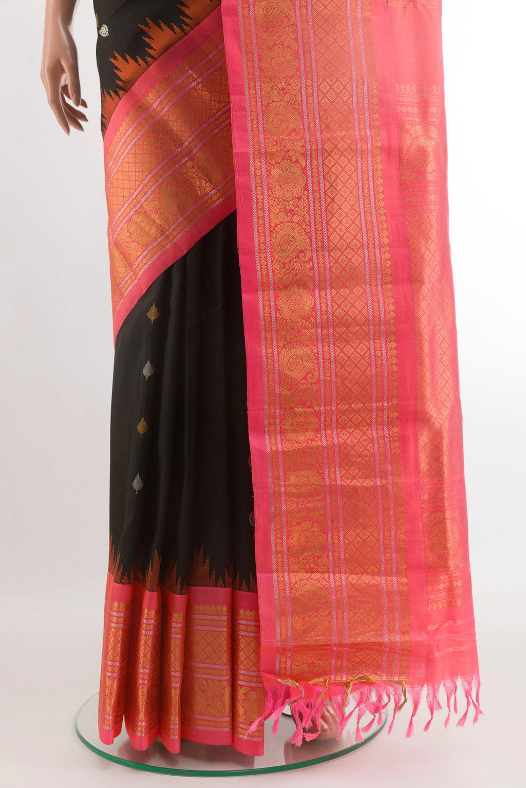 Pleats and pallu of Black Gadwal Silk Saree with Zari Butta on the body and Zari Border. 