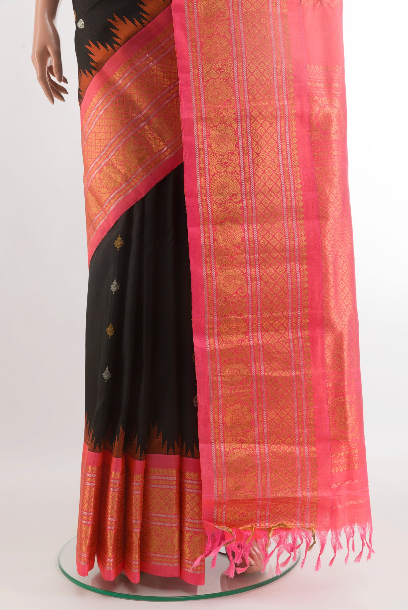 Pleats and pallu of Black Gadwal Silk Saree with Zari Butta on the body and Zari Border. 