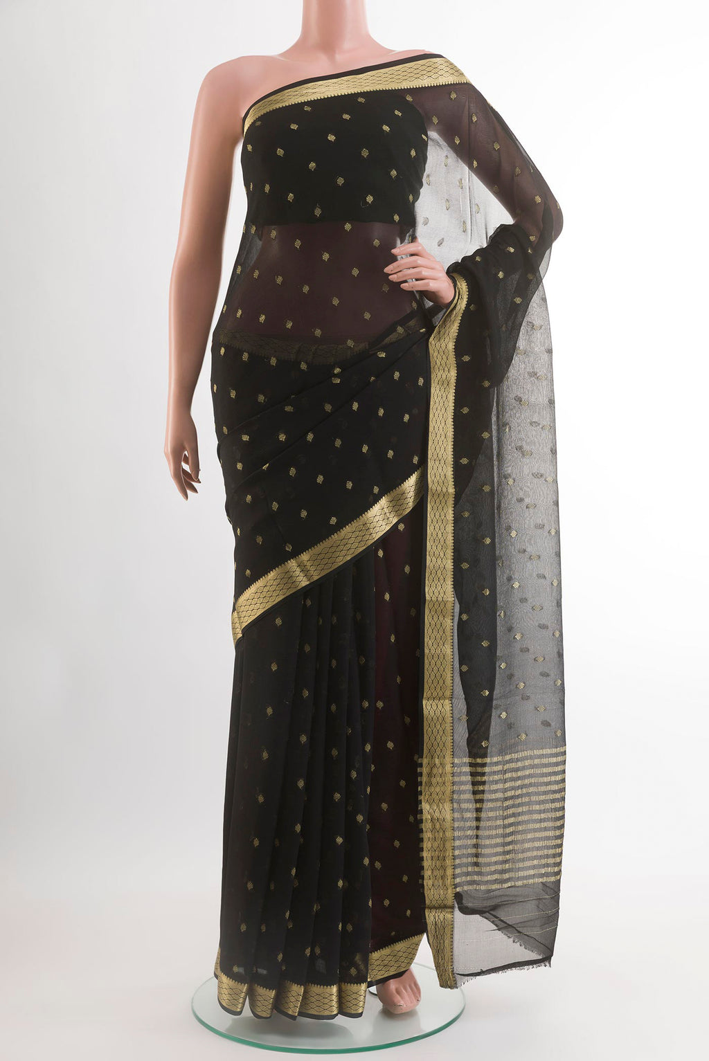 Black Chiffon Saree with Zari Butta on the body and Zari Border.  displayed on a mannequin