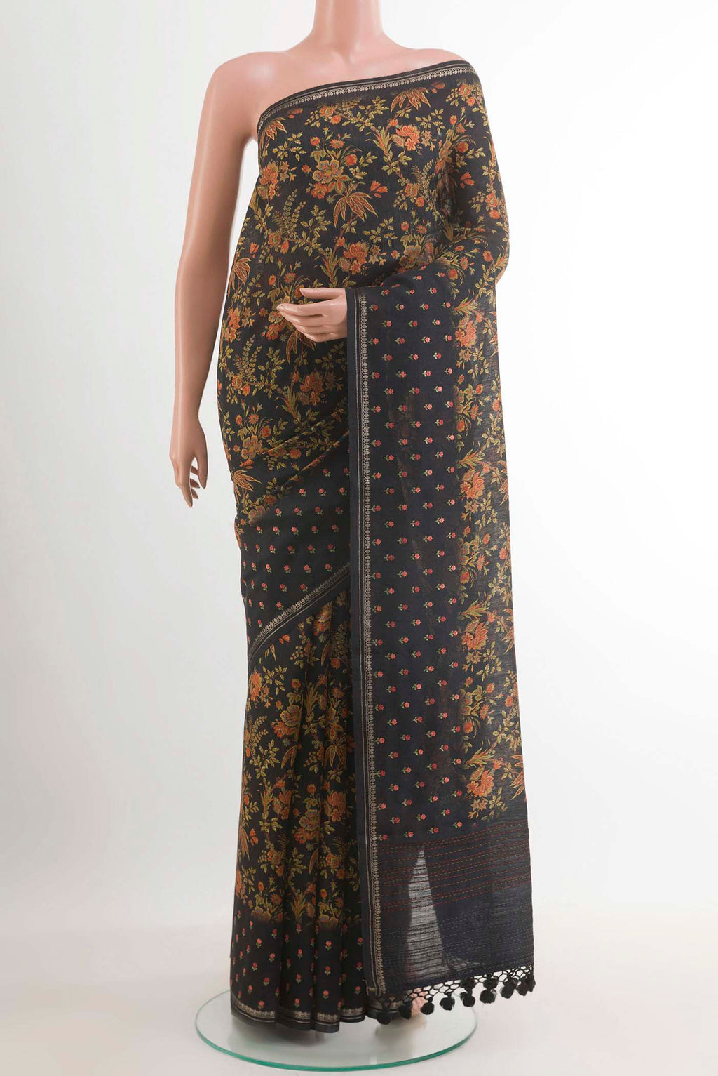 Pure Silk Pure Zari Black Tussar Saree with Printed design on the body and Zari Border.  displayed on a mannequin