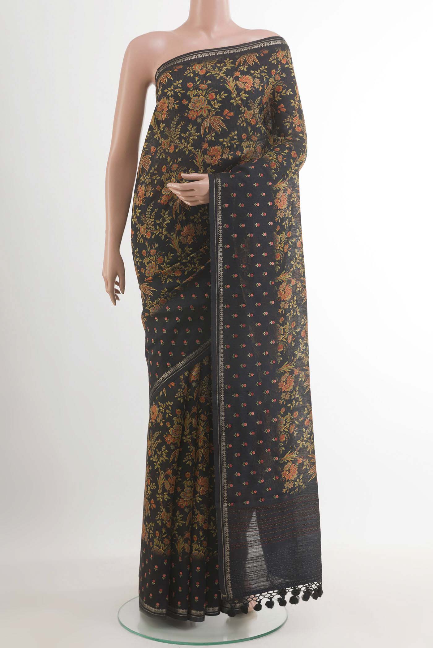 Pure Silk Pure Zari Black Tussar Saree with Printed design on the body and Zari Border.  displayed on a mannequin