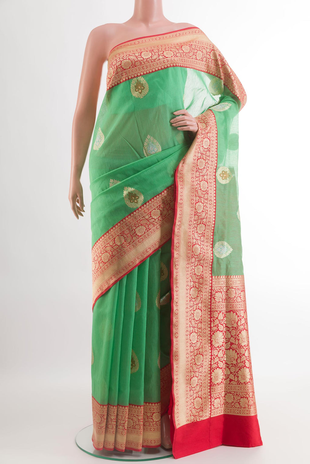 Sea Green Banarasi Kora Silk Saree with Zari Butta on the body and Zari Border.  displayed on a mannequin