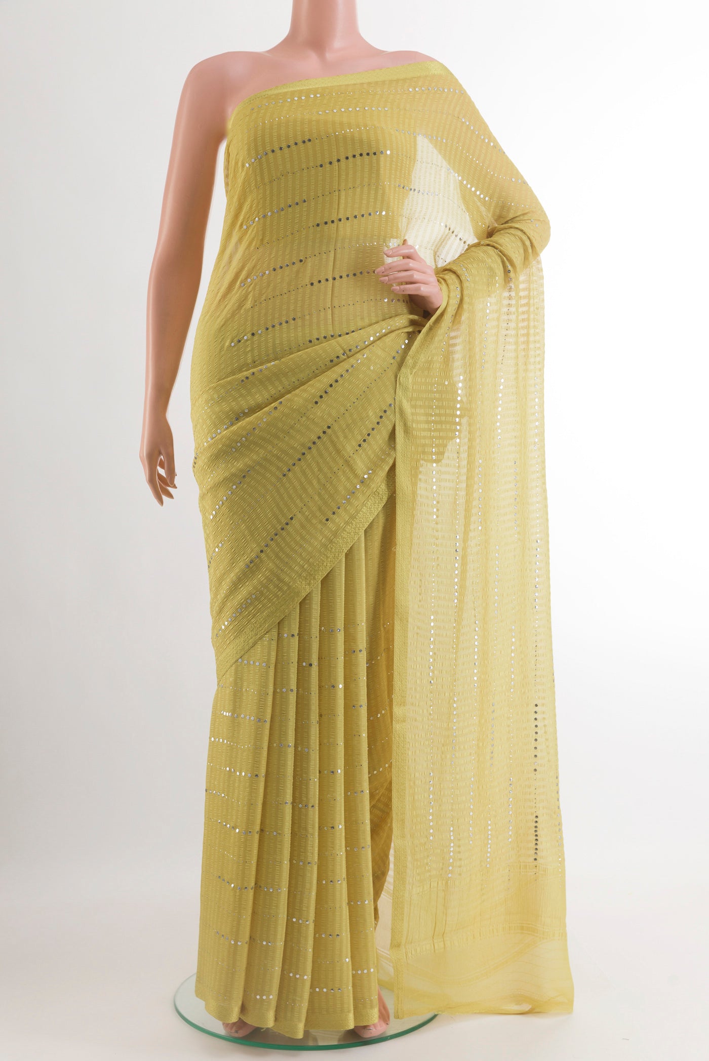 Yellow Mysore Chiffon Saree with Embroidery on the body and Zari Border.  displayed on a mannequin