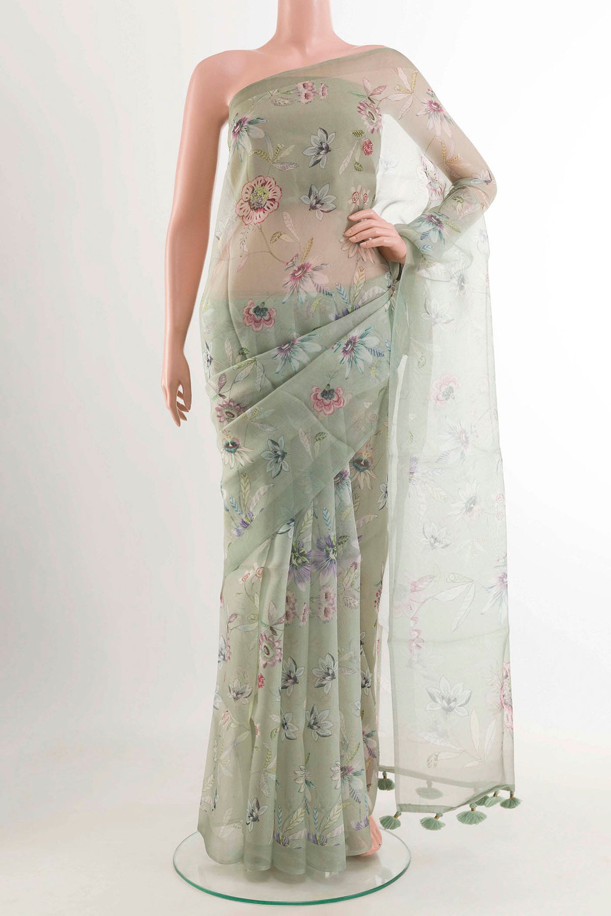 Blue Organza Silk Saree with Printed design on the body and Zari Border displayed on a mannequin