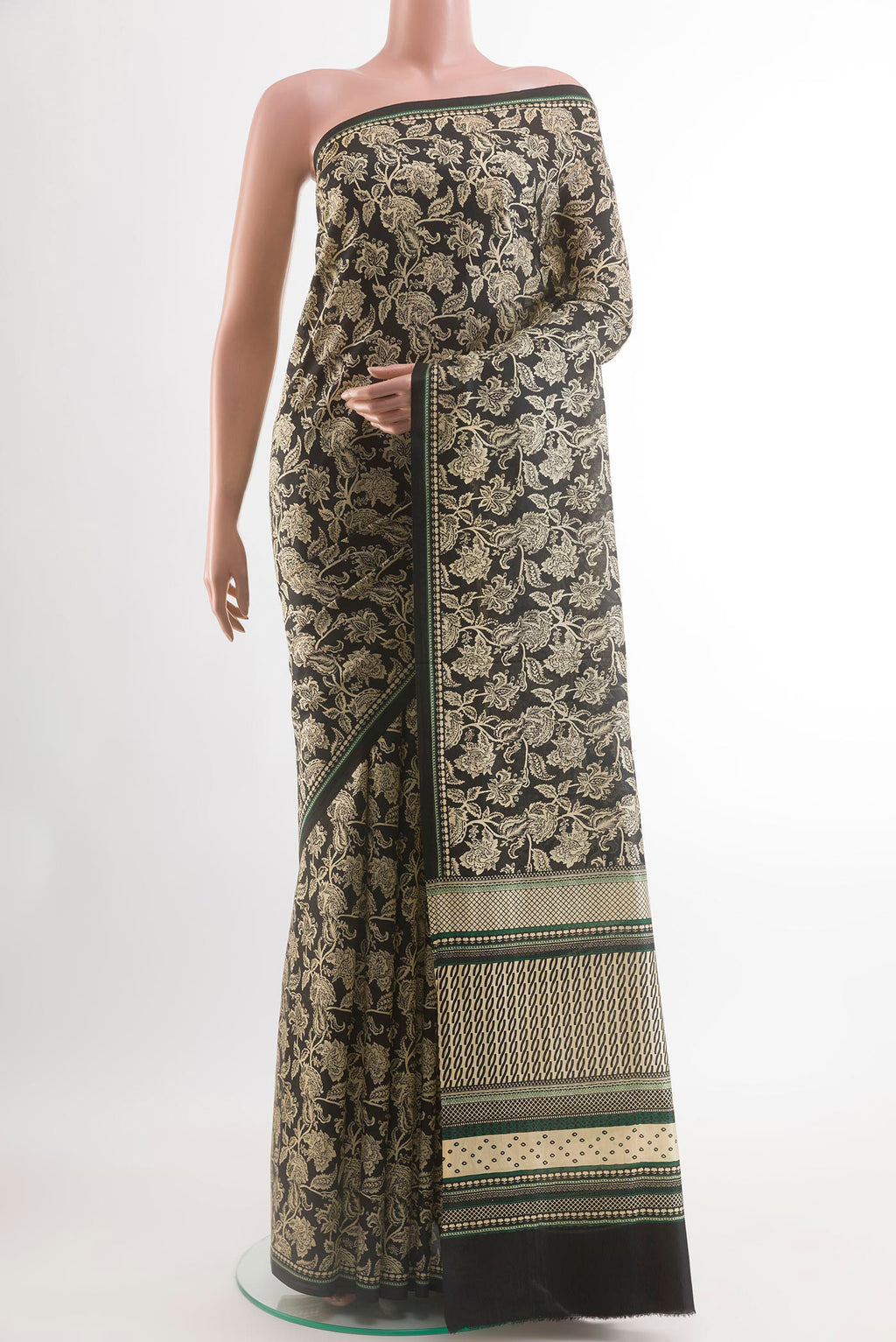 Black Crepe Saree with Printed design on the body and Printed Border.  displayed on a mannequin