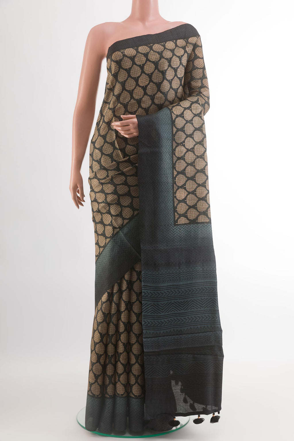 Black Tussar Silk Saree with Printed design on the body and Thread Border.  displayed on a mannequin