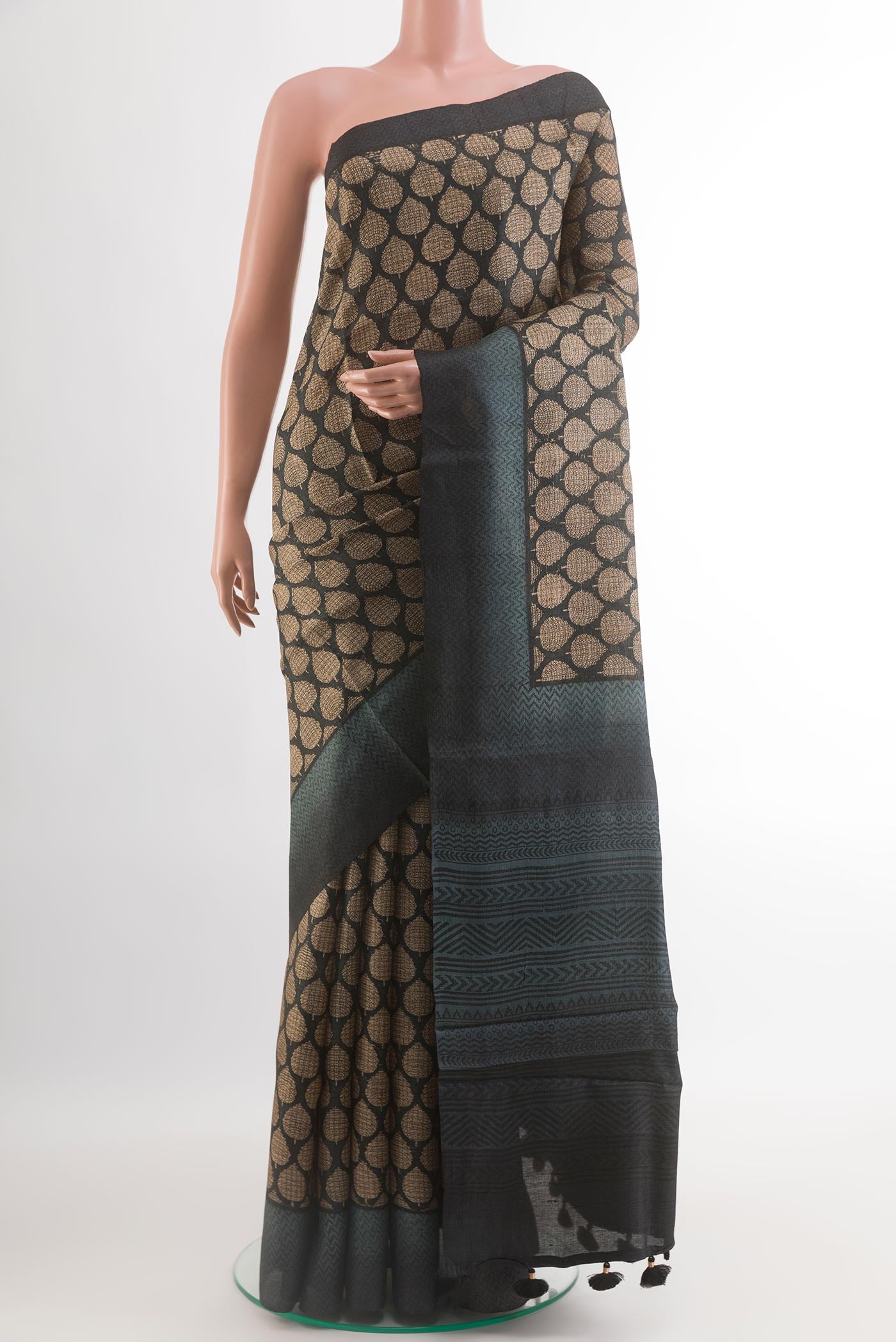 Black Tussar Silk Saree with Printed design on the body and Thread Border.  displayed on a mannequin