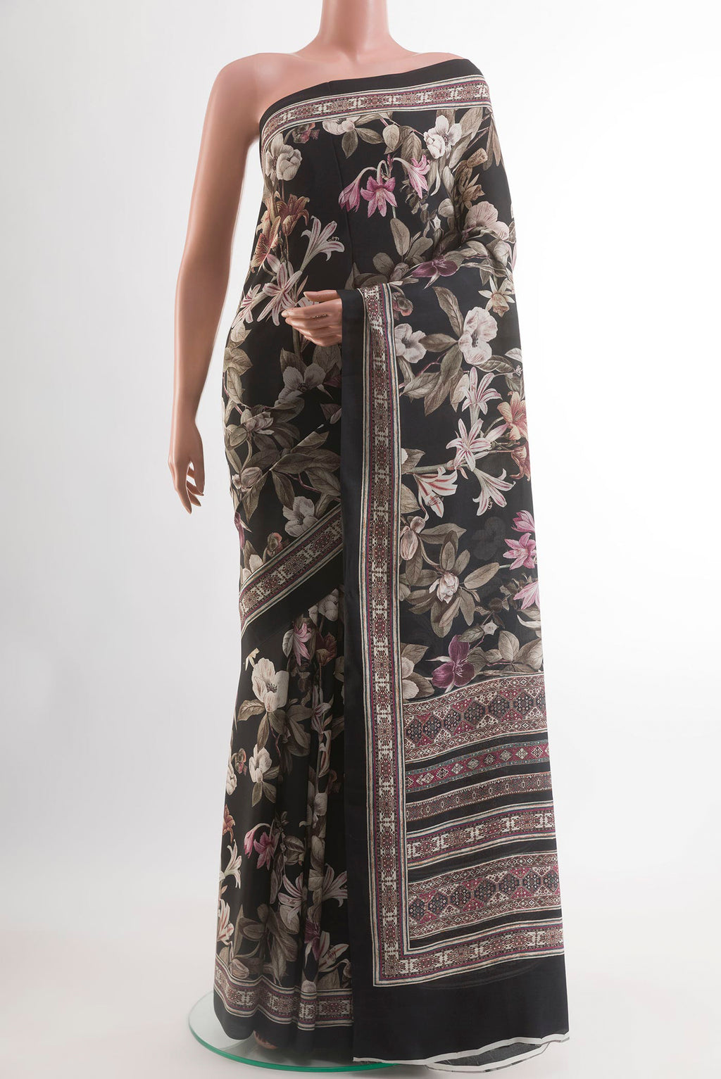Black Crepe Saree with Printed design on the body and Printed Border.  displayed on a mannequin