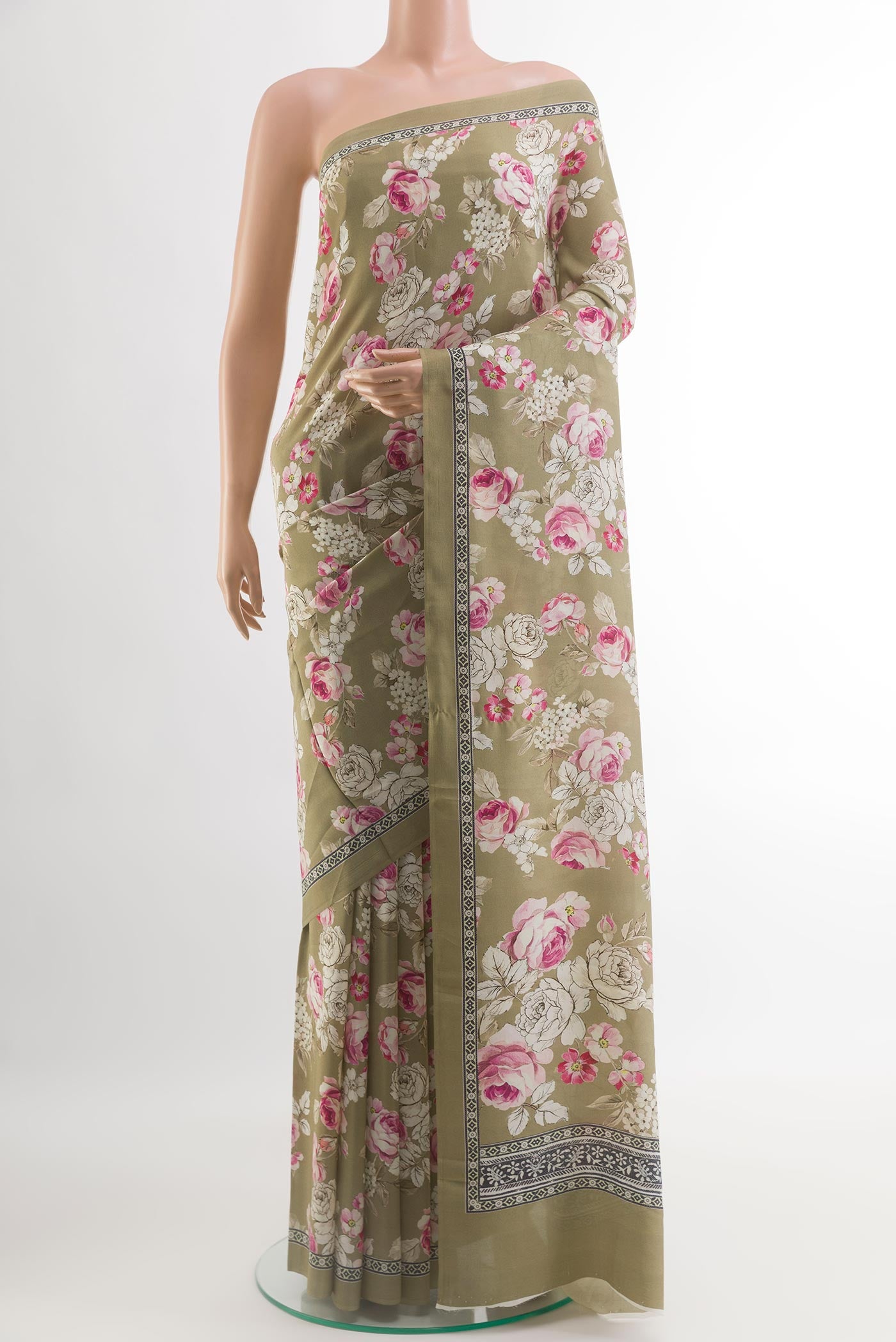 Beige Printed Silk Saree with Floral Print on the body and Printed Border.  displayed on a mannequin