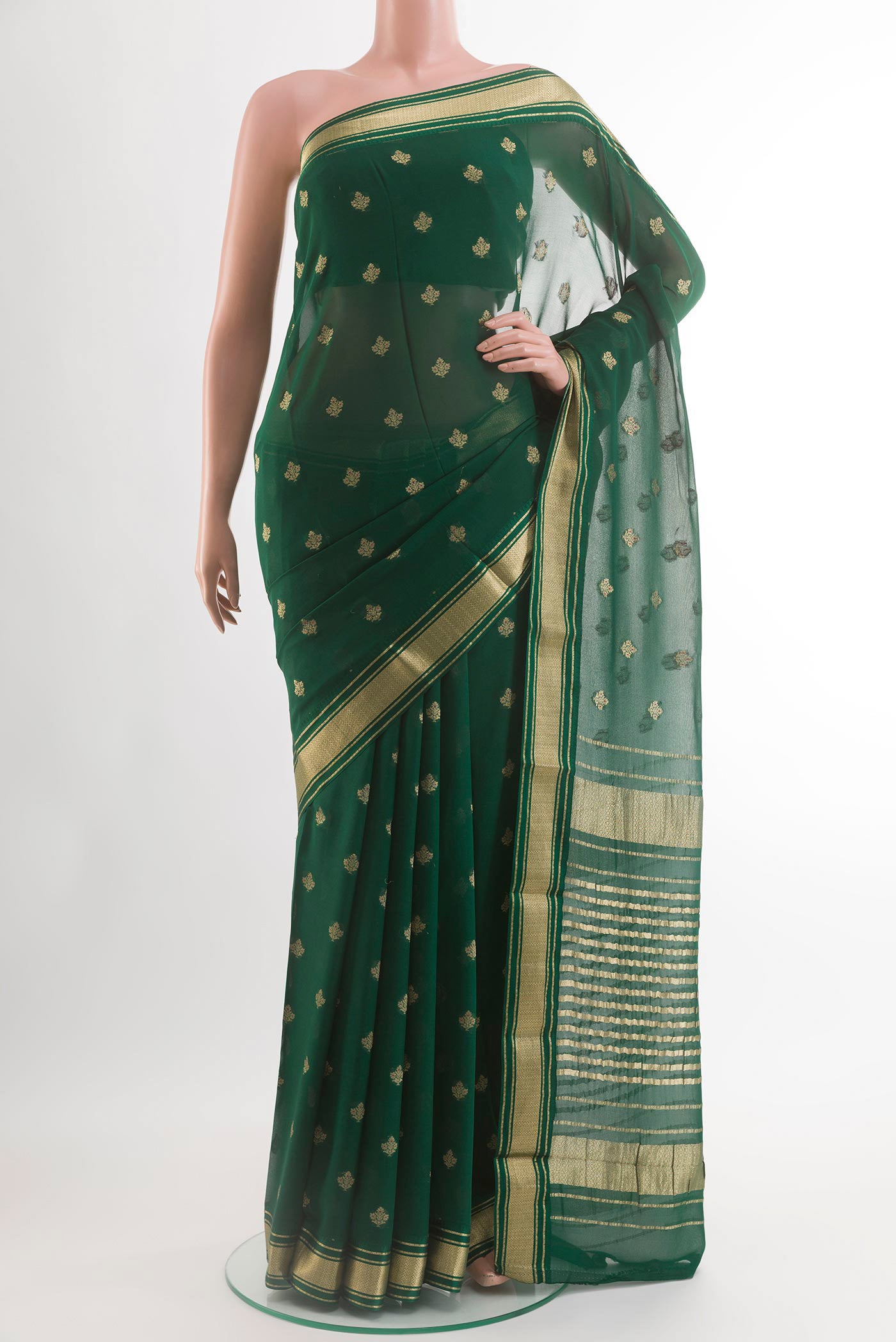 Green Chiffon Saree with Zari Butta on the body and Zari Border.  displayed on a mannequin
