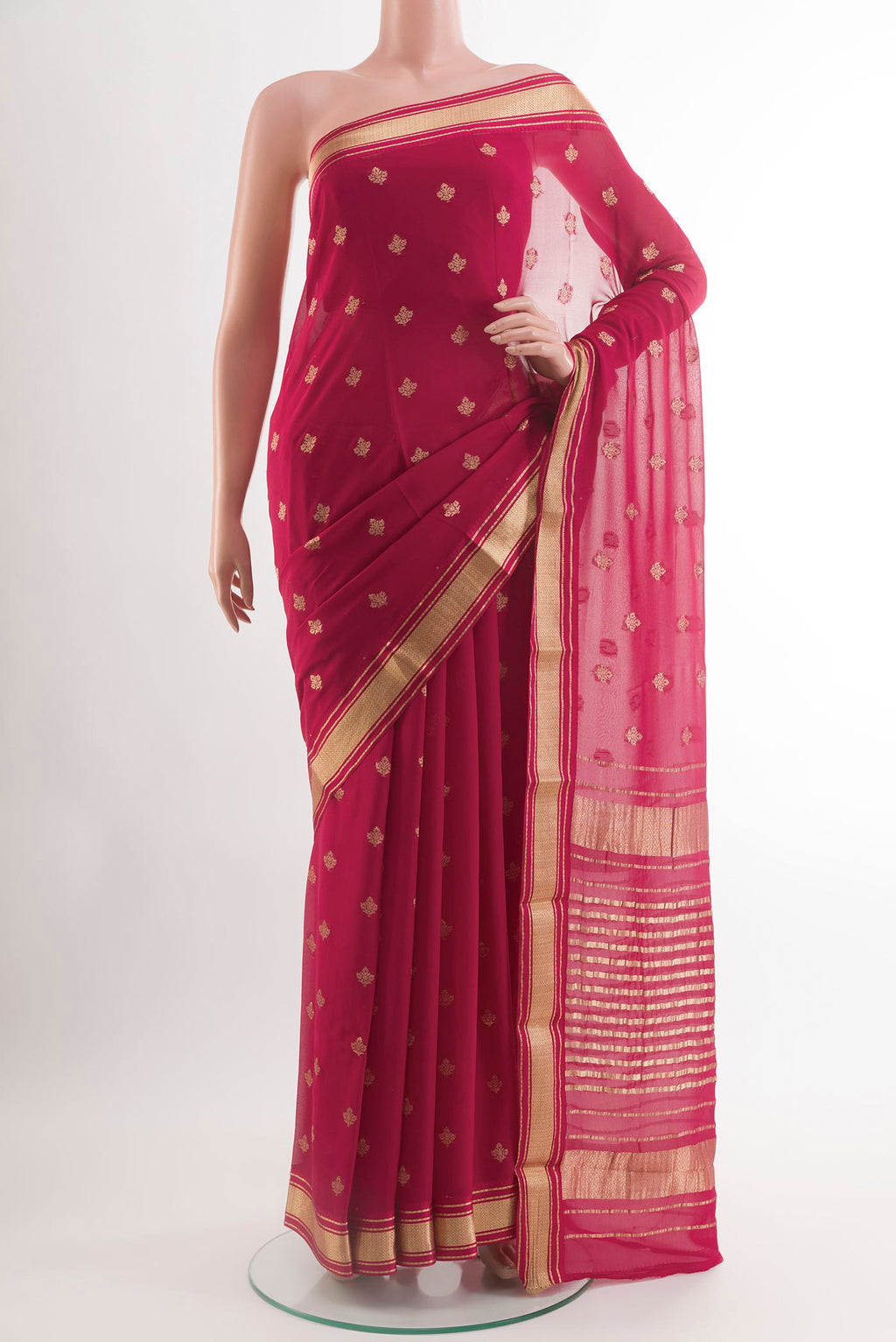 Rani Pink Chiffon Saree with Zari Butta on the body and Zari Border.  displayed on a mannequin