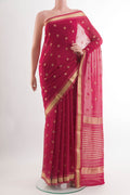 Rani Pink Chiffon Saree with Zari Butta on the body and Zari Border.  displayed on a mannequin