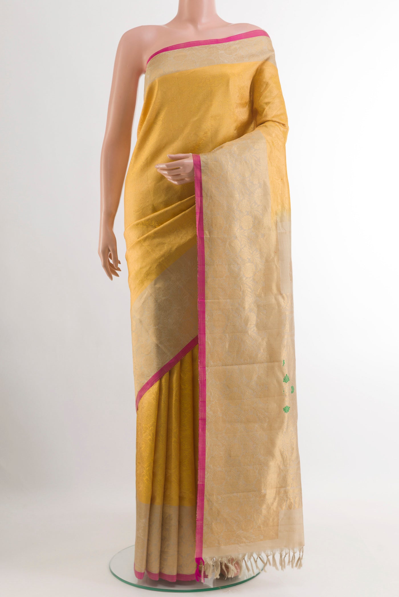 Yellow Gadwal Silk Saree with Zari Brocade on the body and Fancy Border.  displayed on a mannequin