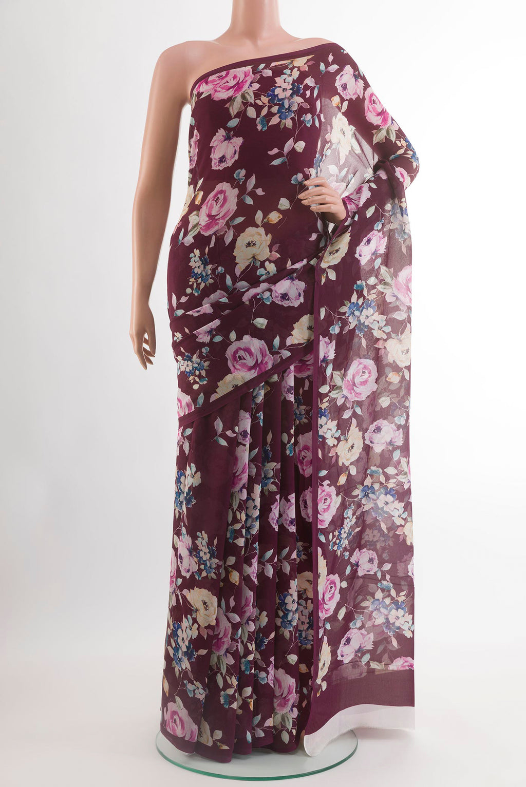 Maroon Chiffon Saree with Printed design on the body and Plain Border.  displayed on a mannequin