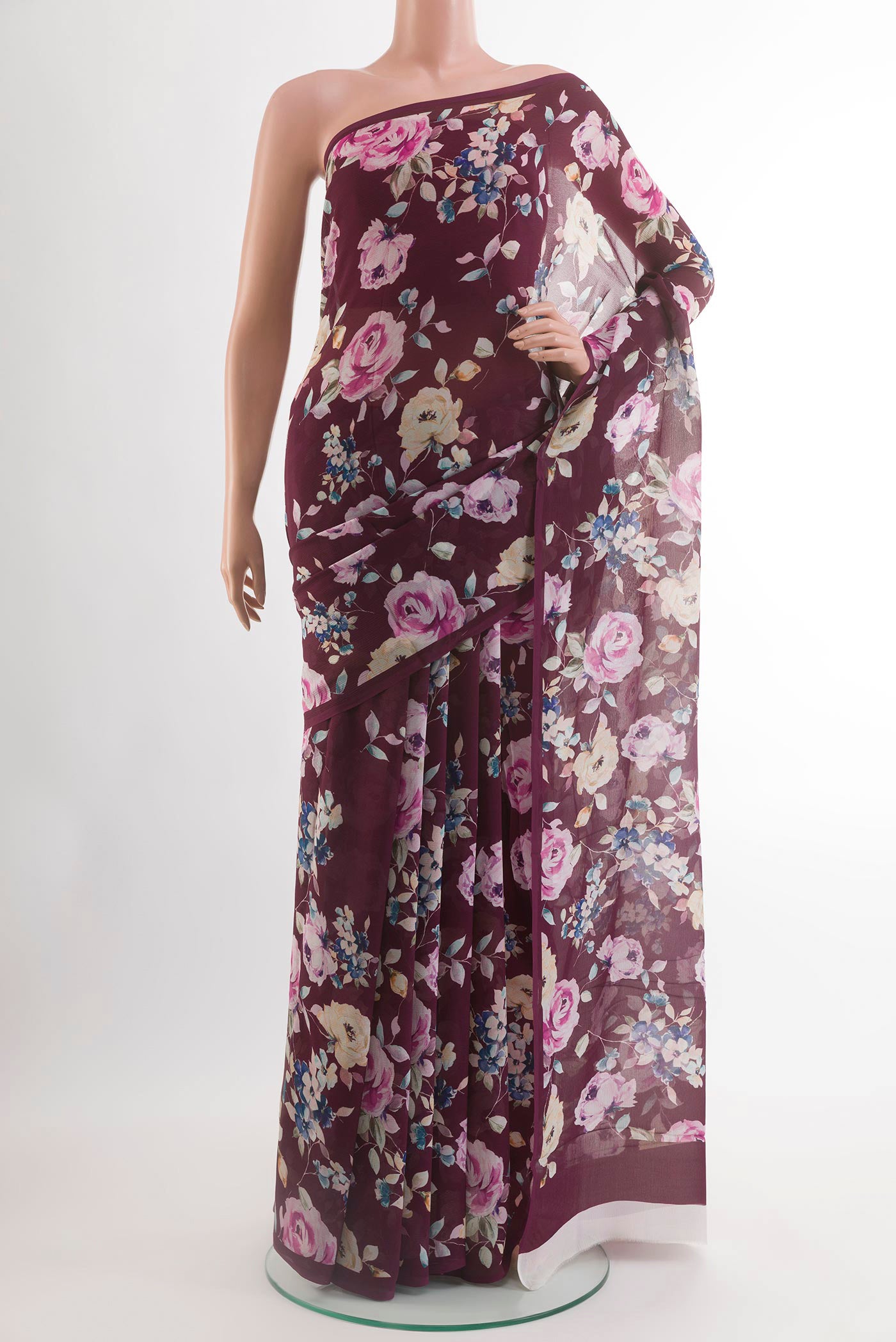 Maroon Chiffon Saree with Printed design on the body and Plain Border.  displayed on a mannequin