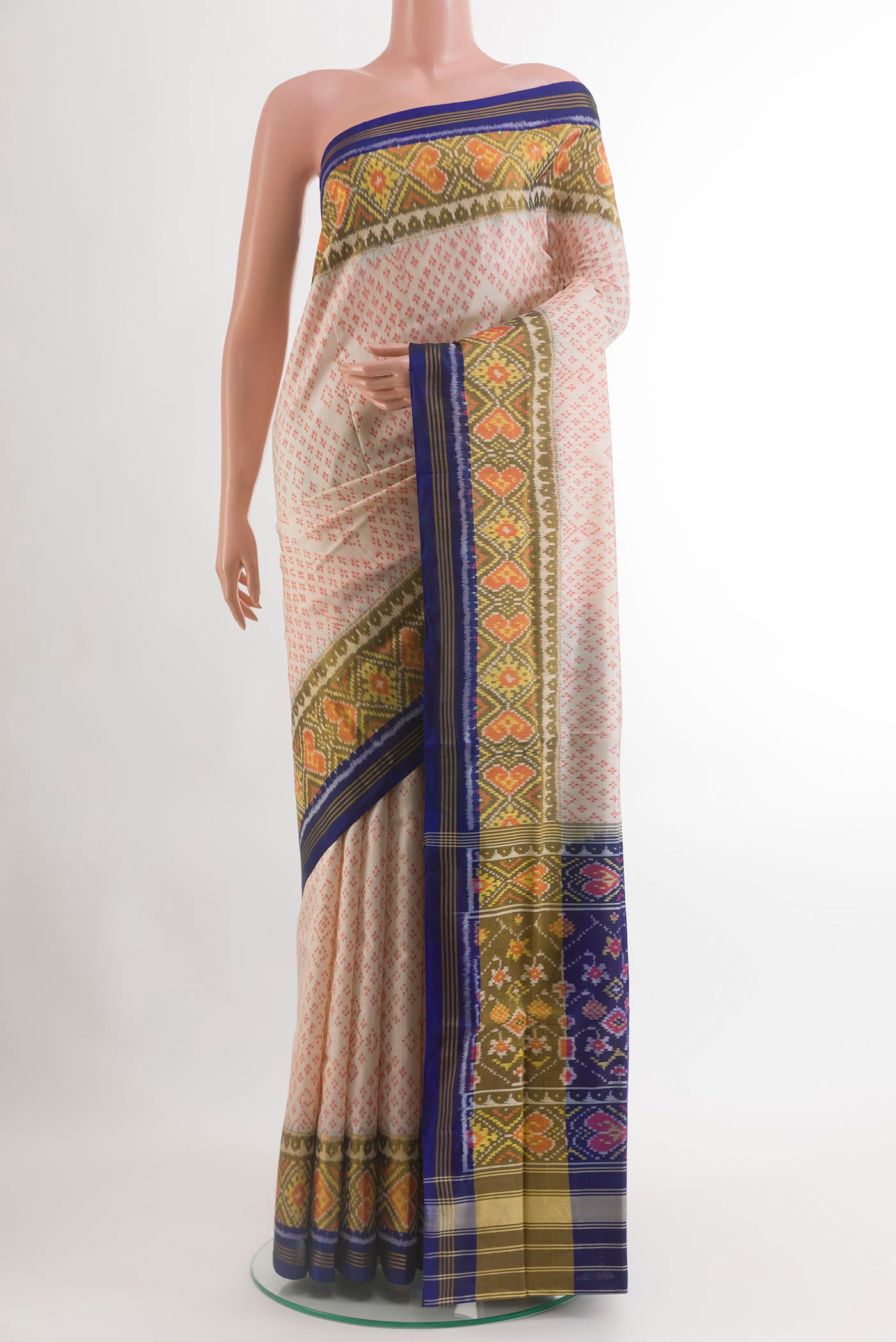 Off White Rajkot Patola Silk Saree with Pure Ikat on the body and Zari Border.  displayed on a mannequin
