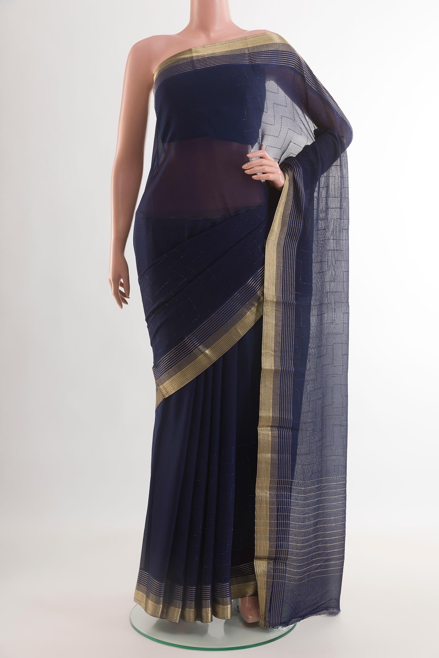 Navy Blue Mysore Chiffon Saree with Embroidery on the body and Zari Border.  displayed on a mannequin