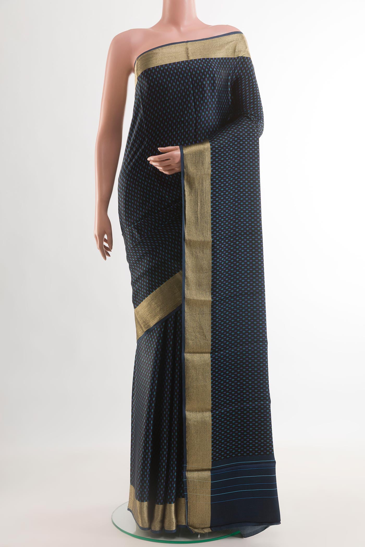 Black Satin Silk Saree with Printed design on the body and Zari Border.  displayed on a mannequin