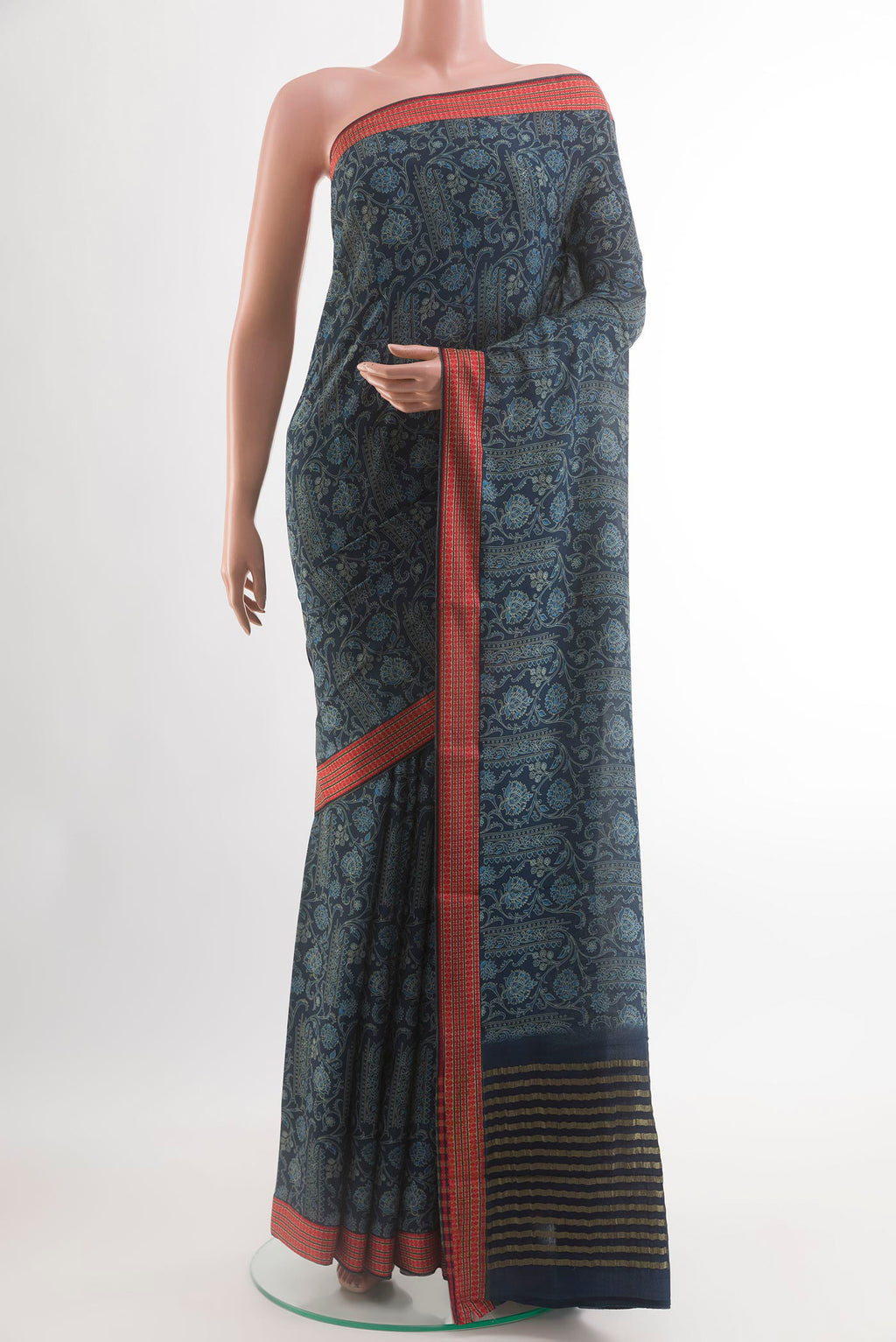 Blue Crepe Saree with Printed design on the body and Printed Border.  displayed on a mannequin