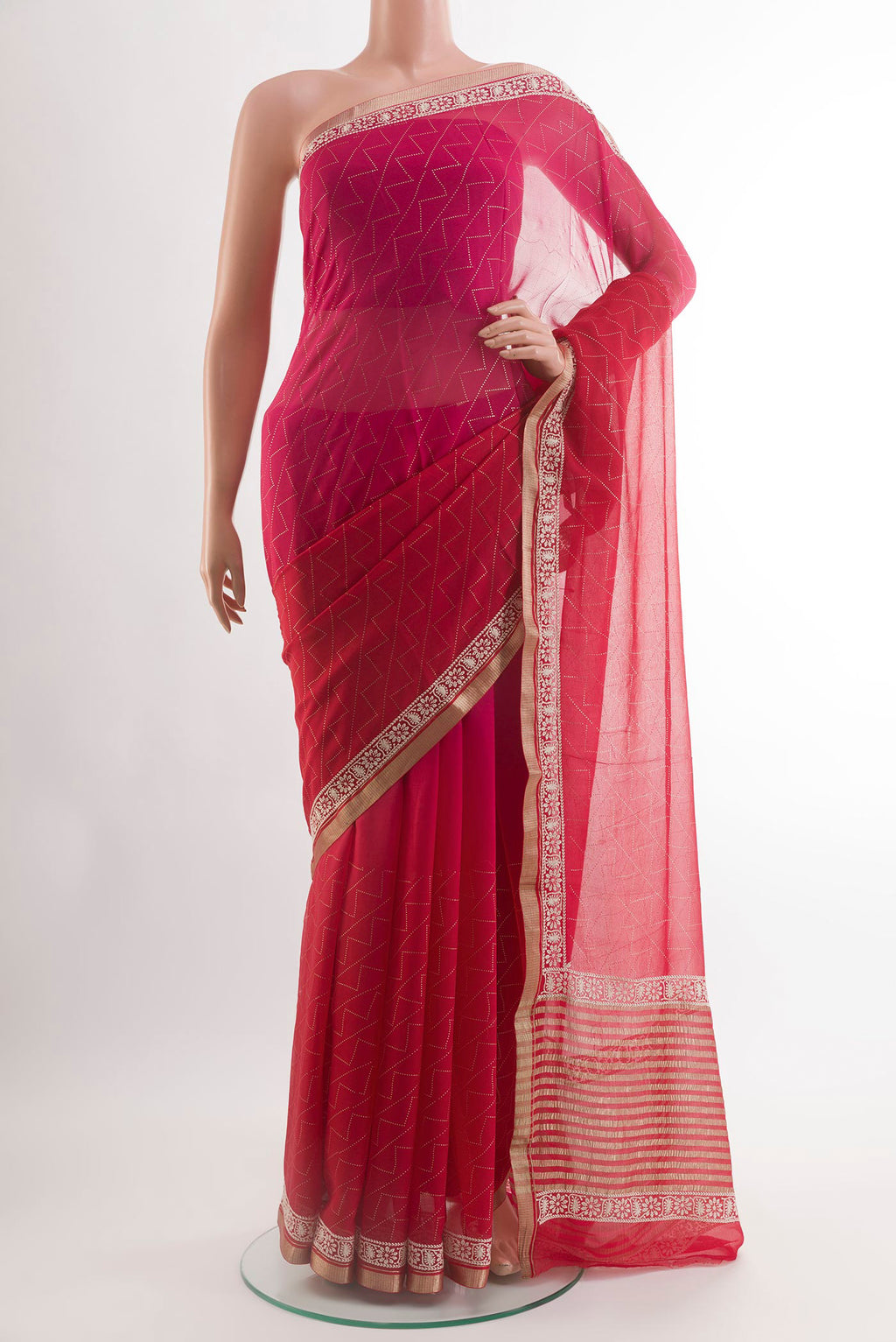 Red Chiffon Saree with Embroidery on the body and Zari Border.  displayed on a mannequin