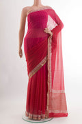 Red Chiffon Saree with Embroidery on the body and Zari Border.  displayed on a mannequin